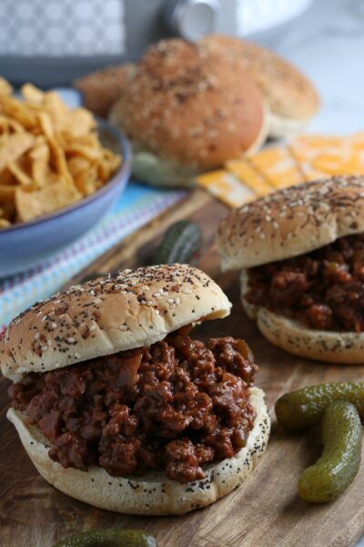 Homemade Sloppy Joes served with Fritos, cheese and pickles